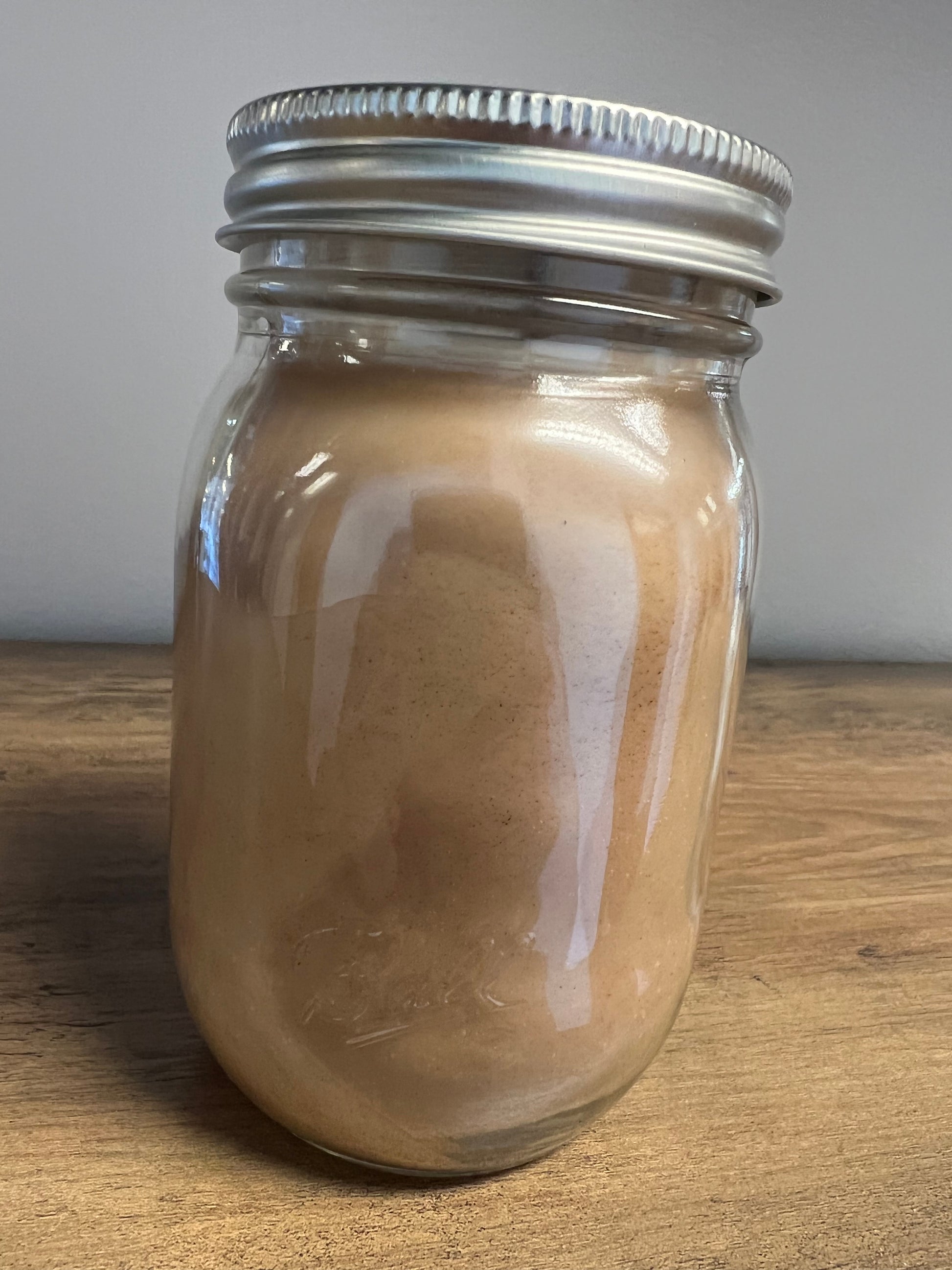 Side view of Pumpkin Pie Candle in Ball Canning Jar with Lid Installed